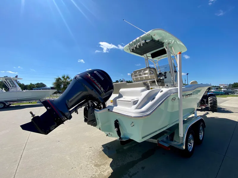 Slide: The Image of 2024 Key West 219 FS boat with outboard motor on trailer. - 4