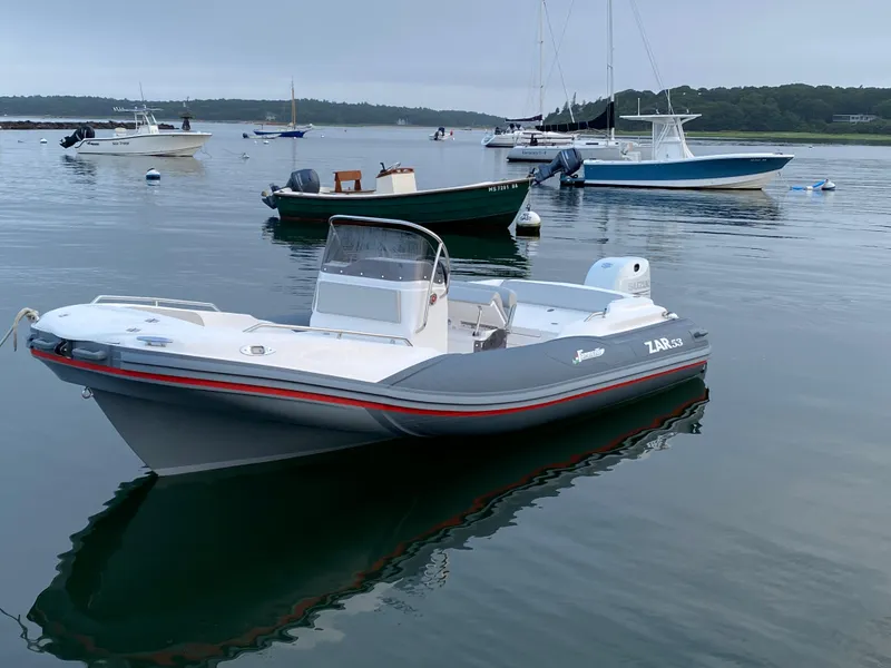 The Image of 2024 Zar Formenti 53 SPC boat on calm water with other boats in the background. - 1
