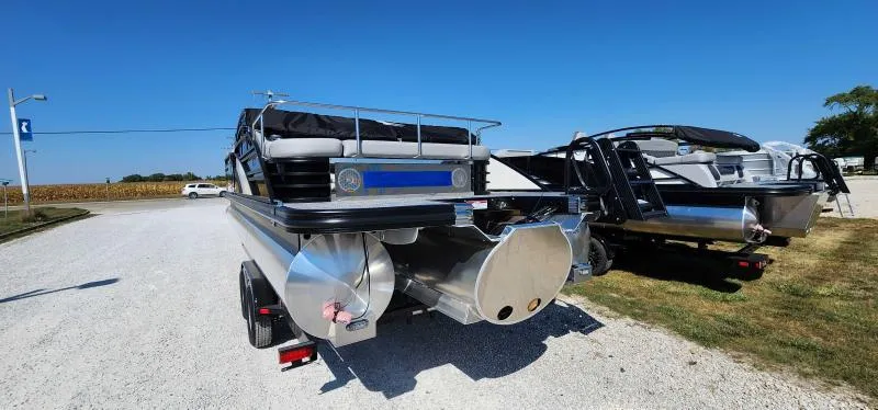 Slide: The Image of 2024 Bennington 26 LXSSB pontoon boat on a trailer, rear view. - 2
