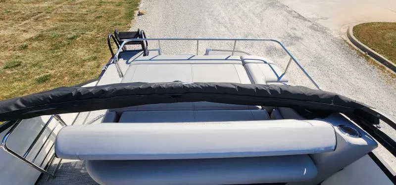 Slide: The Image of 2024 Bennington 26 LXSSB pontoon boat with spacious seating and sun deck. - 3