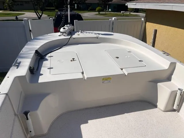 Slide: The Image of 2019 Carolina Skiff 258 DLV boat deck with storage compartments. - 13