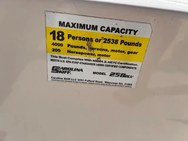 Slide: The Image of 2019 Carolina Skiff 258 DLV maximum capacity label, 18 persons or 2538 pounds, 200 horsepower. - 19