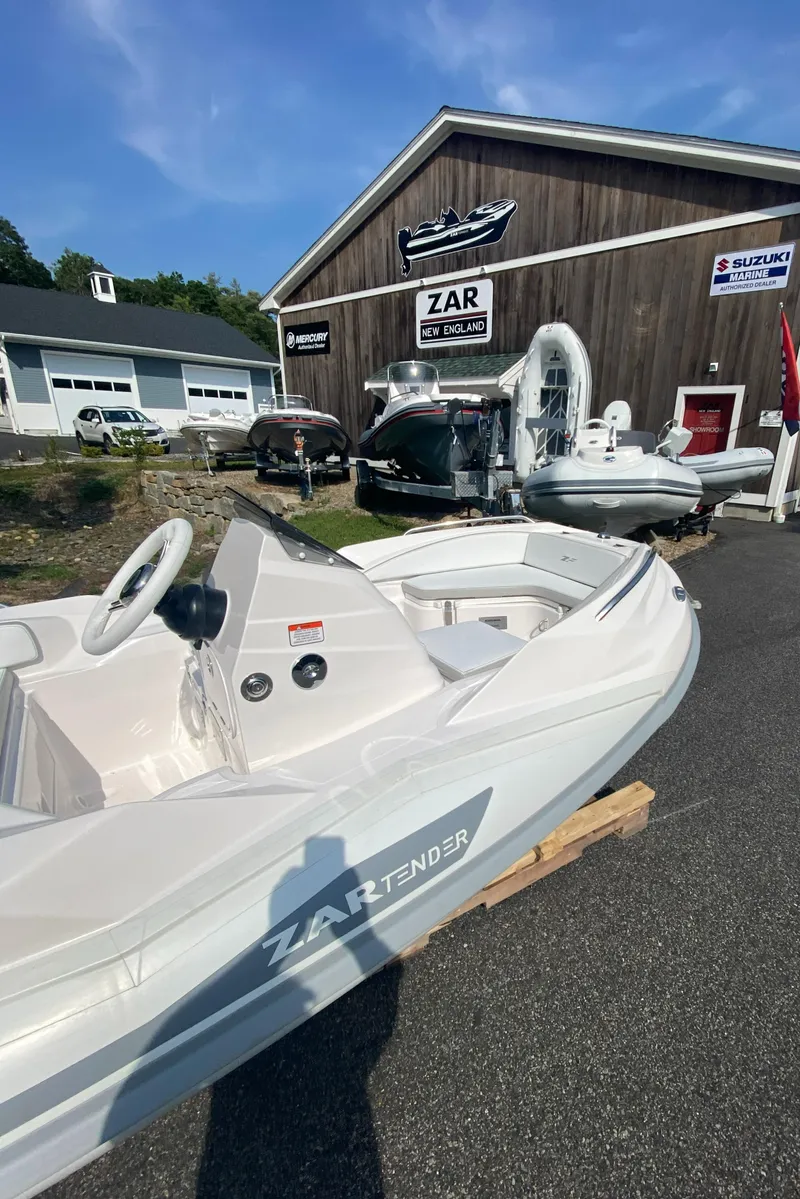 Slide: The Image of 2024 Zar Formenti TENDER ZF-1 boat displayed at a dealership. - 6