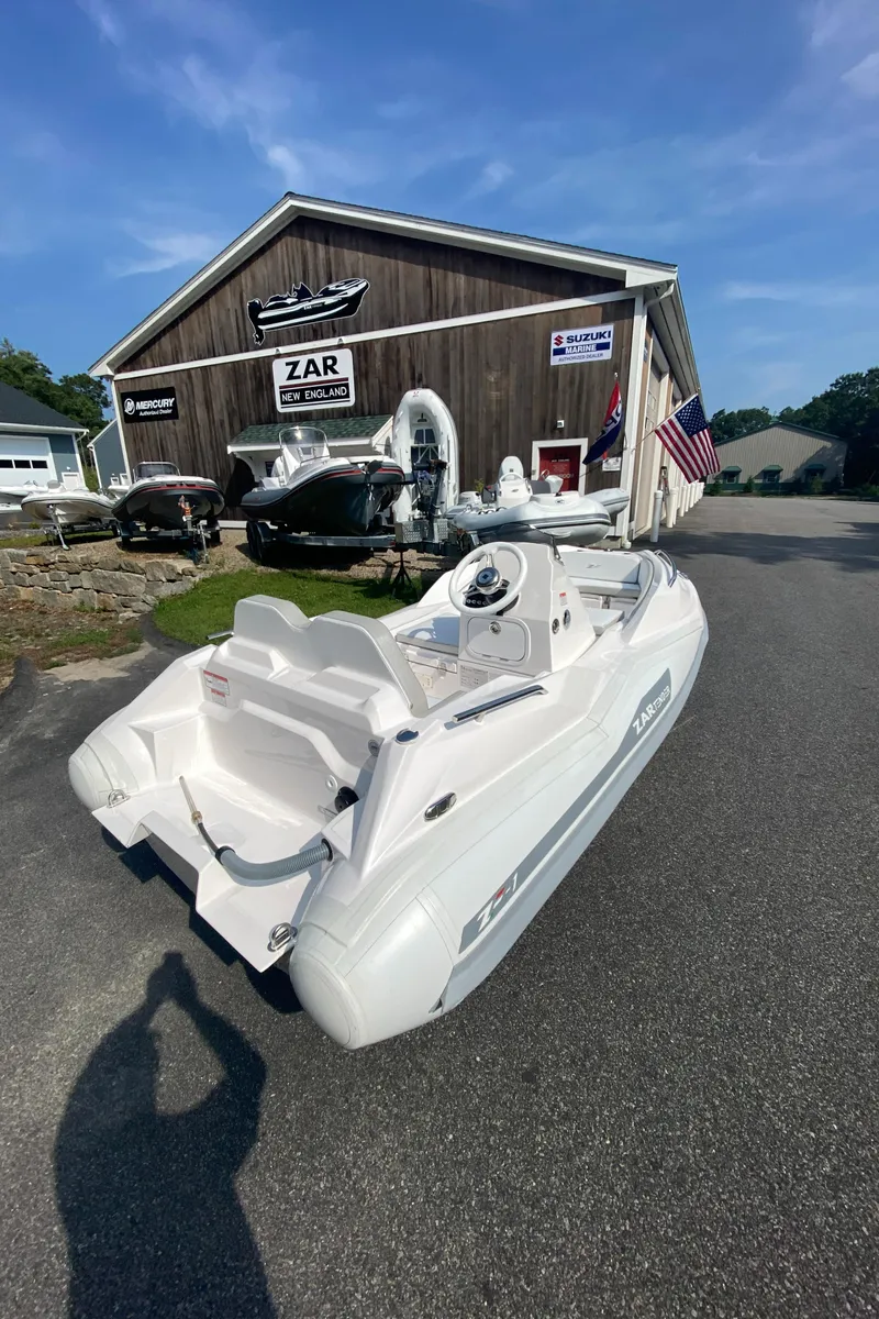 Slide: The Image of 2024 Zar Formenti TENDER ZF-1 boat displayed outside dealership. - 8