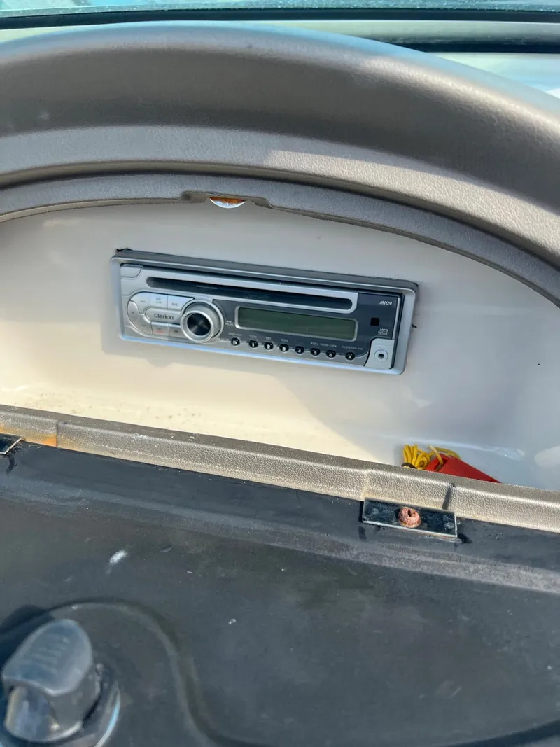 Slide: The Image of Dashboard of a 2006 Sea Ray 205 Sport boat featuring a stereo system. - 10