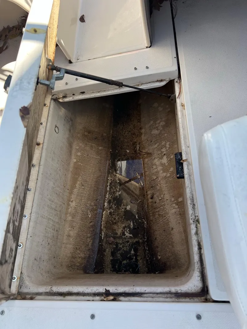 Slide: The Image of Open storage compartment on a 2006 Sea Ray 205 Sport boat. - 13