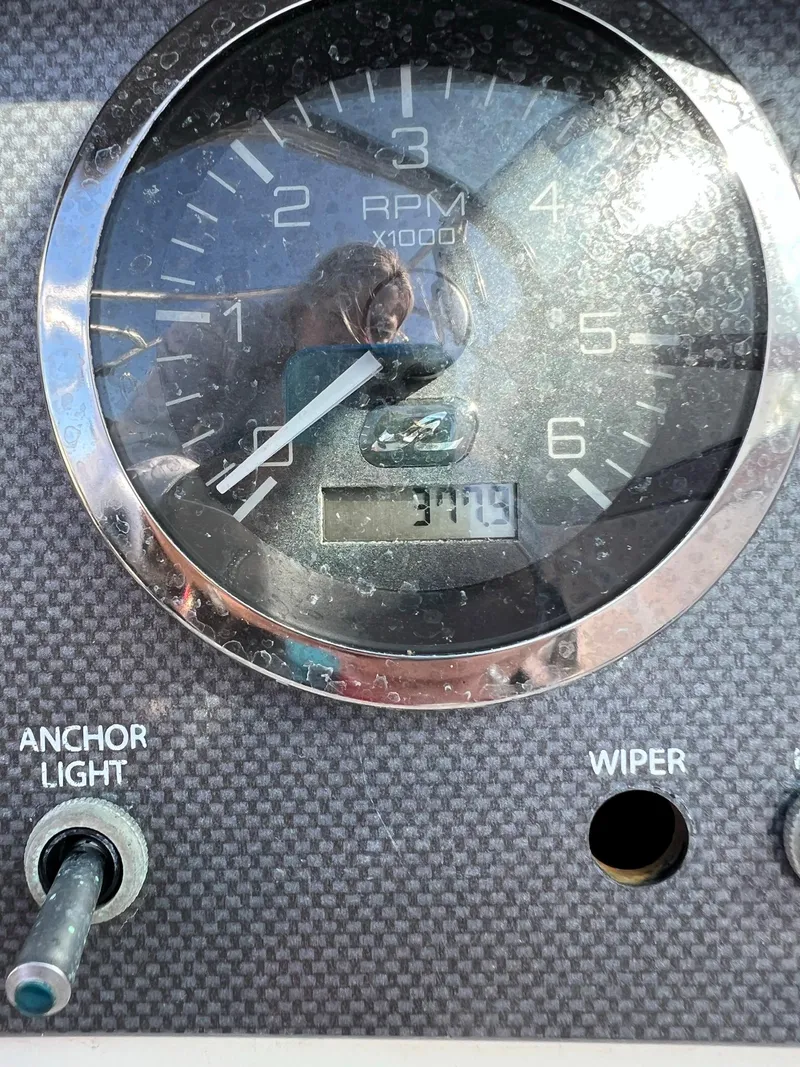 Slide: The Image of Close-up of 2006 Sea Ray 205 Sport RPM gauge and controls. - 15