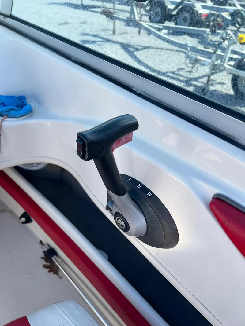 Slide: The Image of Throttle control of a 2006 Sea Ray 205 Sport boat, featuring a sleek design. - 9