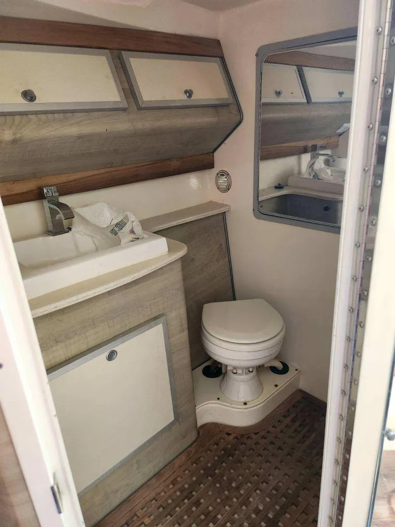 Slide: The Image of 2018 Pronautica 1260 Super Sport boat bathroom with sink, toilet, and mirror. - 10