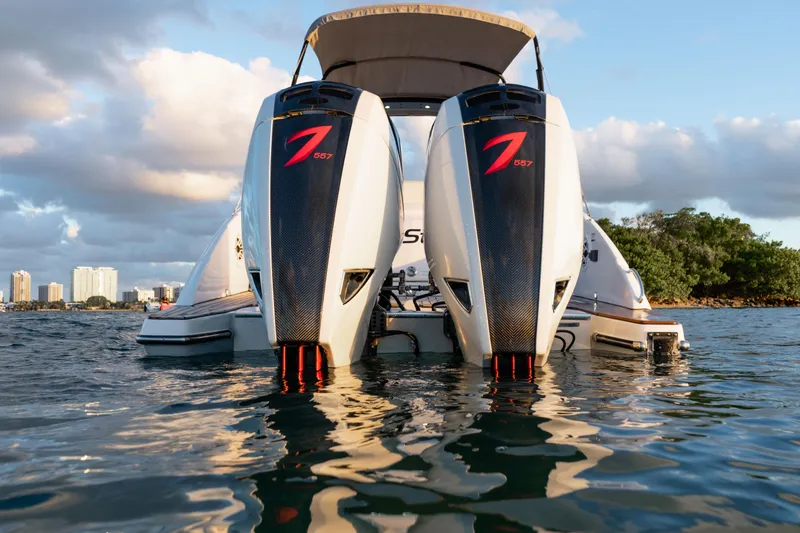 Slide: The Image of 2018 Pronautica 1260 Super Sport boat with twin outboard engines on water. - 17