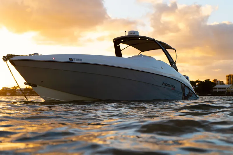 Slide: The Image of 2018 Pronautica 1260 Super Sport boat at sunset on the water. - 18