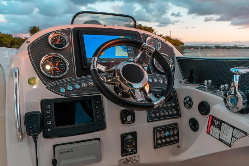 Slide: The Image of Control panel of 2018 Pronautica 1260 Super Sport boat at sunset. - 19