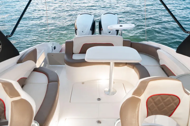 Slide: The Image of 2018 Pronautica 1260 Super Sport boat interior with seating and table, overlooking water. - 21