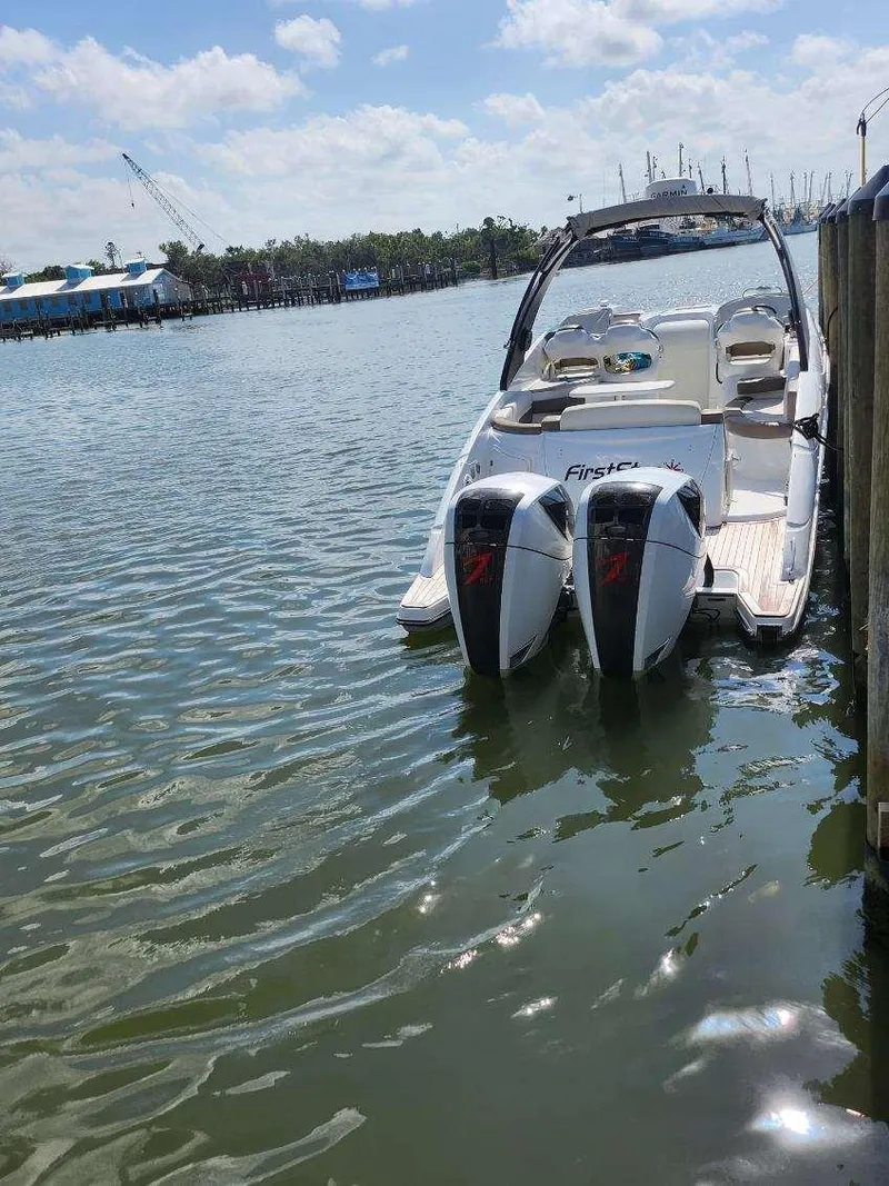 Slide: The Image of 2018 Pronautica 1260 Super Sport boat docked with twin engines. - 9