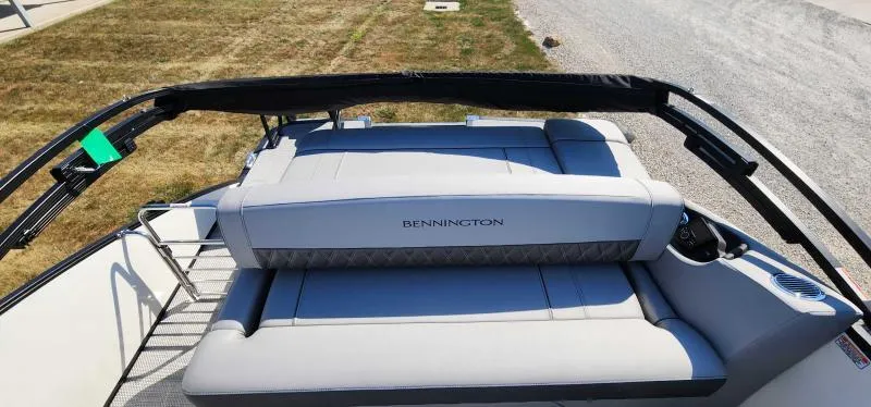 Slide: The Image of 2024 Bennington 25 RTSB boat with luxurious seating and sleek design. - 8