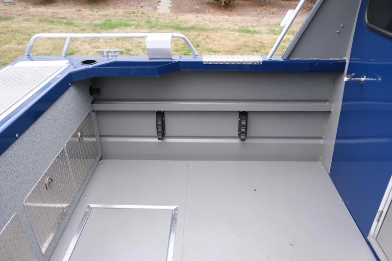 Slide: The Image of 2024 Thunder Jet 21 Chinook Pro boat interior, featuring storage compartments and a clean, spacious deck. - 10