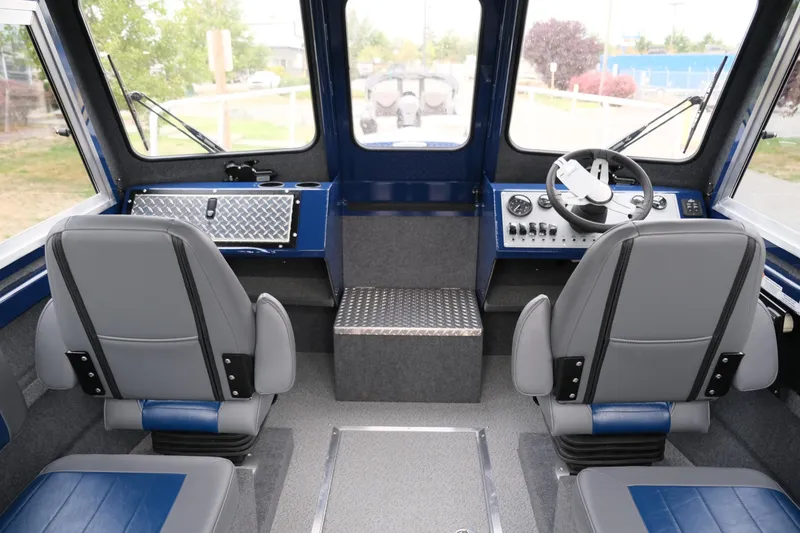 Slide: The Image of Interior of 2024 Thunder Jet 21 Chinook Pro boat with dual seats and control panel. - 14