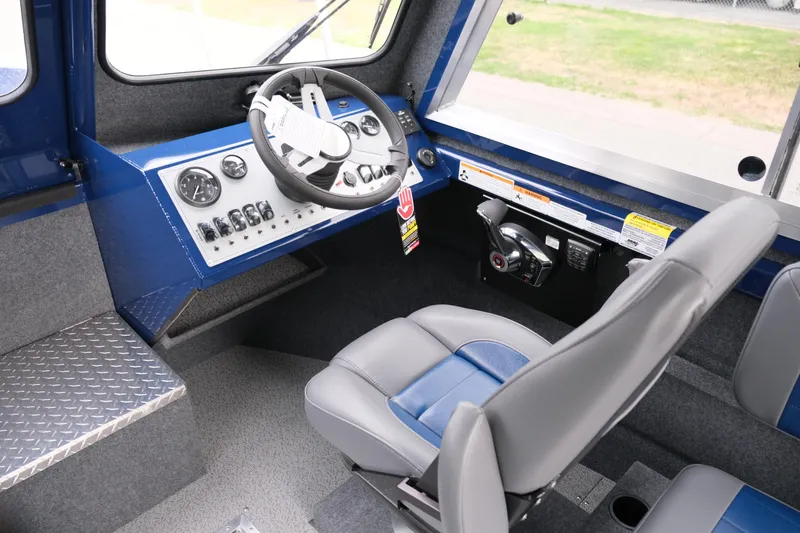 Slide: The Image of Interior cockpit of 2024 Thunder Jet 21 Chinook Pro boat with steering wheel and control panel. - 17