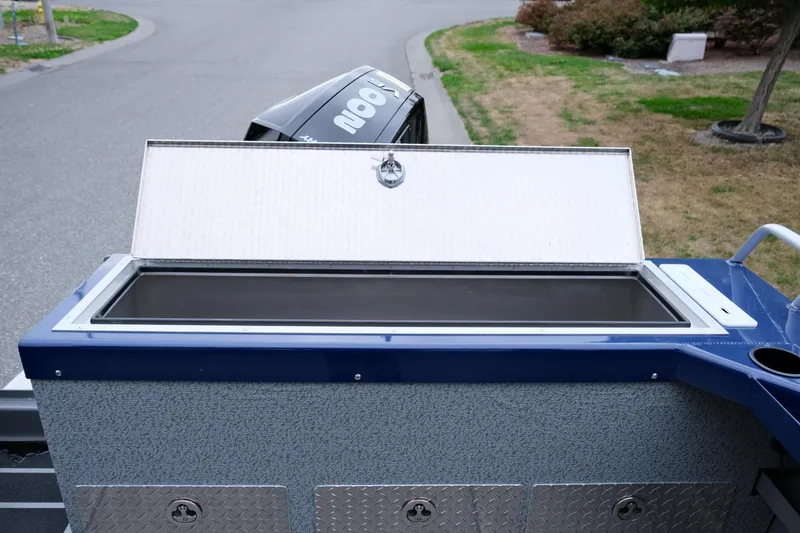 Slide: The Image of Open storage compartment on a 2024 Thunder Jet 21 Chinook Pro boat. - 23