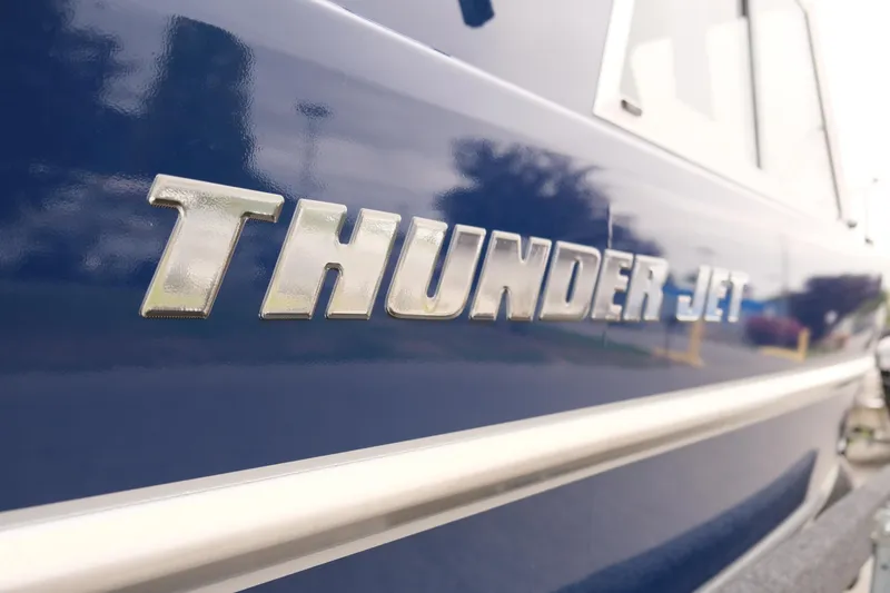 Slide: The Image of Close-up of 2024 Thunder Jet 21 Chinook Pro boat nameplate. - 24
