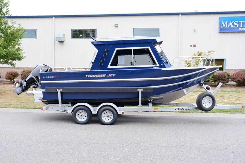 Slide: The Image of 2024 Thunder Jet 21 Chinook Pro boat on a trailer. - 4