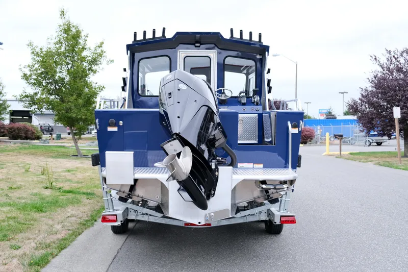 Slide: The Image of 2024 Thunder Jet 21 Chinook Pro boat rear view with outboard motor. - 5