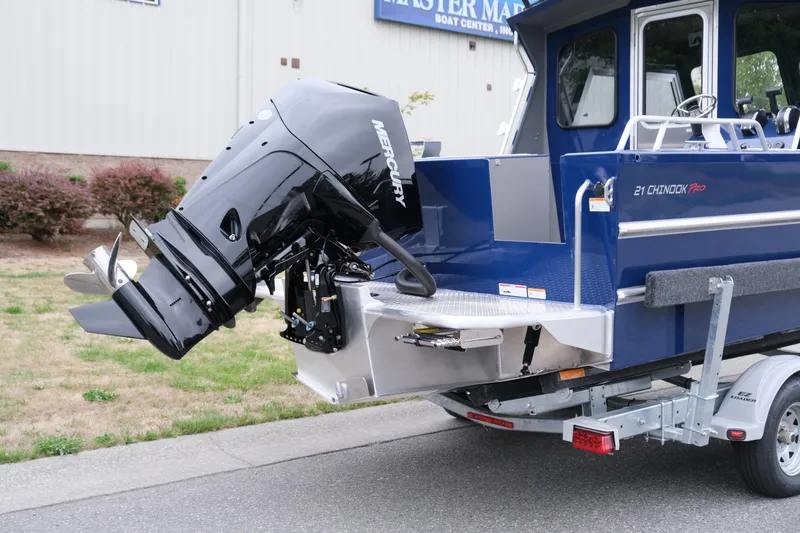 Slide: The Image of 2024 Thunder Jet 21 Chinook Pro boat with Mercury outboard motor on trailer. - 6