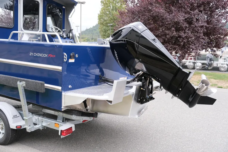 Slide: The Image of 2024 Thunder Jet 21 Chinook Pro boat with outboard motor on trailer. - 7