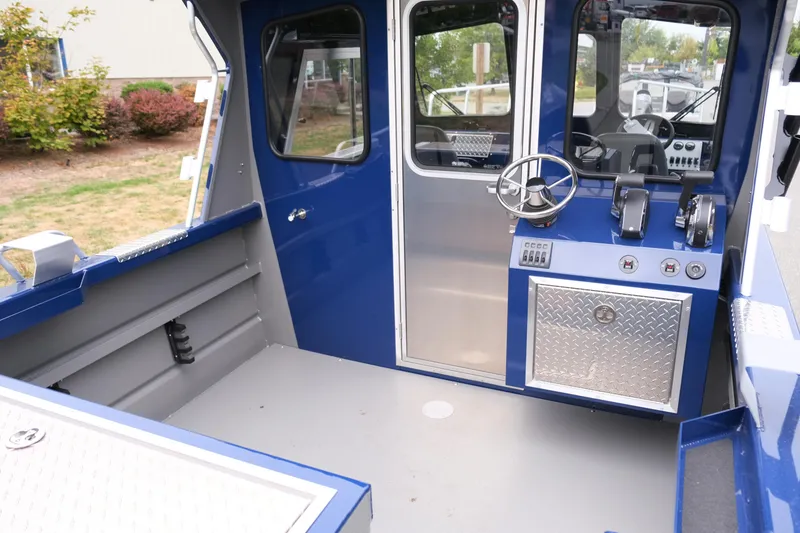 Slide: The Image of 2024 Thunder Jet 21 Chinook Pro boat interior with steering wheel and control panel. - 9