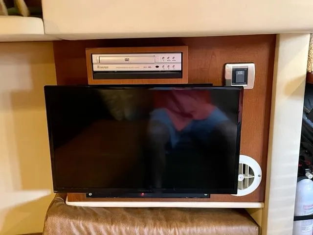 Slide: The Image of Entertainment system in a 2007 Sea Ray 38 Sundancer yacht interior. - 14