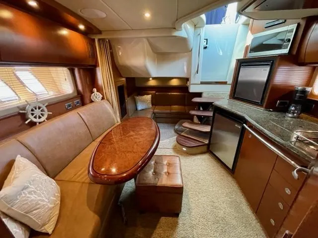 Slide: The Image of Luxurious interior of a 2007 Sea Ray 38 Sundancer yacht with elegant wood finishes. - 16