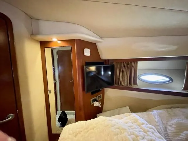 Slide: The Image of Interior cabin of 2007 Sea Ray 38 Sundancer with TV and porthole window. - 27