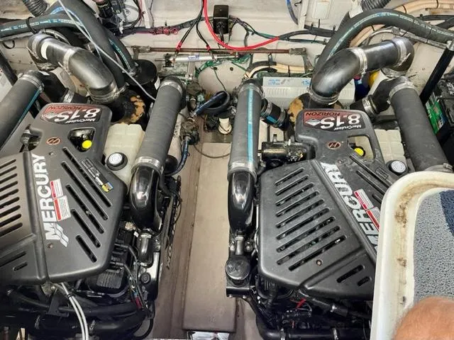 Slide: The Image of Twin Mercury engines in a 2007 Sea Ray 38 Sundancer boat. - 28