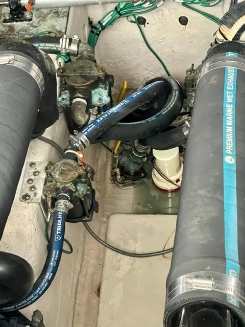 Slide: The Image of Engine compartment of a 2007 Sea Ray 38 Sundancer with marine hoses and components. - 29