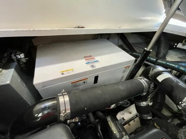 Slide: The Image of Engine compartment of 2007 Sea Ray 38 Sundancer with visible components and hoses. - 31