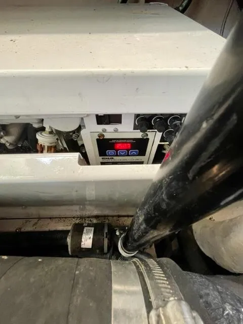 Slide: The Image of Engine compartment of a 2007 Sea Ray 38 Sundancer boat, showing control panel and components. - 32