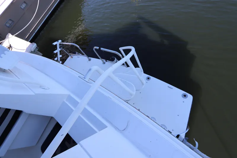 Slide: The Image of 1991 Viking Motor Yacht stern view with swim platform and ladder. - 20