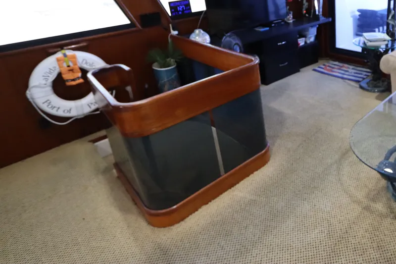 Slide: The Image of Interior of a 1991 Viking Motor Yacht with a wooden staircase and life preserver. - 23