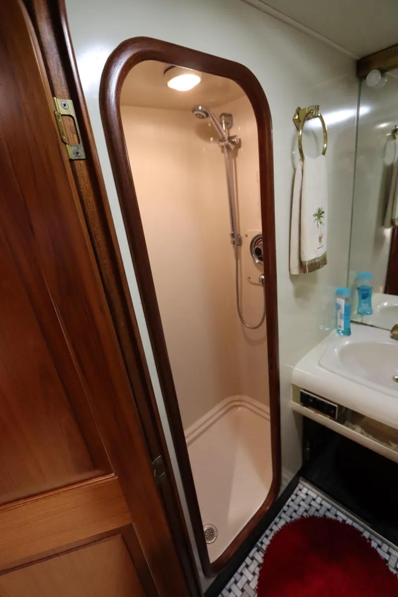 Slide: The Image of 1991 Viking Motor Yacht bathroom with shower and sink. - 28