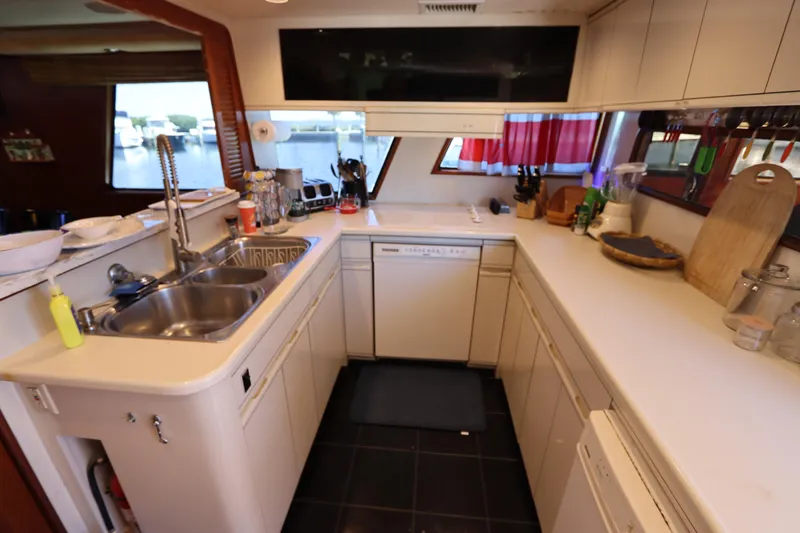 Slide: The Image of 1991 Viking Motor Yacht kitchen with modern appliances and ample counter space. - 41