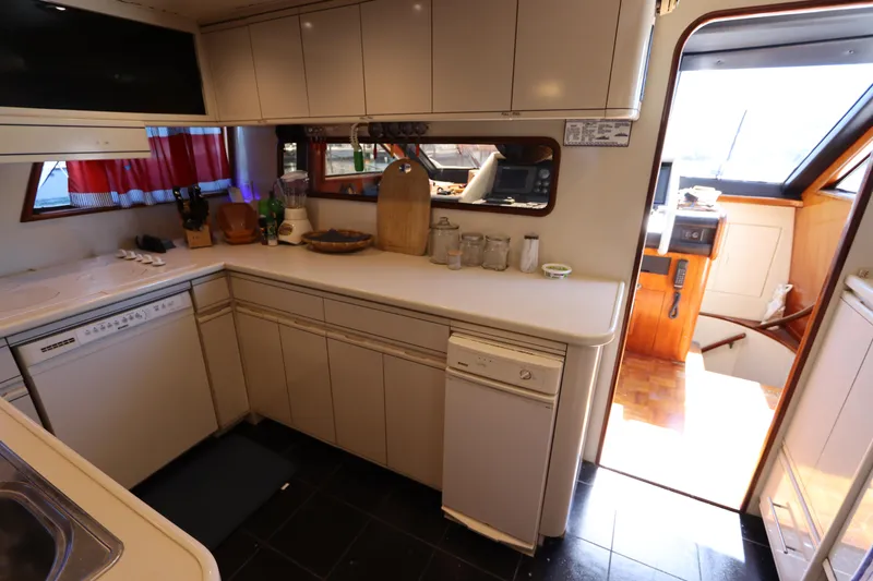 Slide: The Image of 1991 Viking Motor Yacht kitchen with modern appliances and ample counter space. - 45