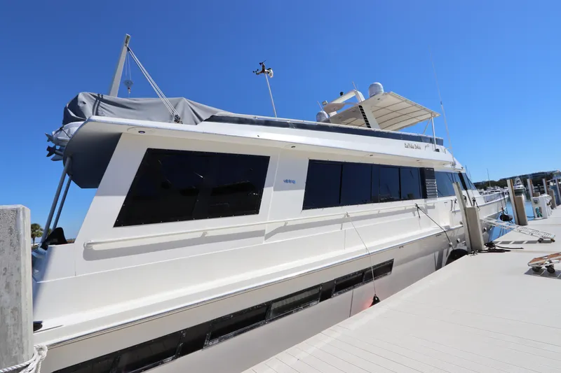 Slide: The Image of 1991 Viking Motor Yacht docked at marina under clear blue sky. - 5