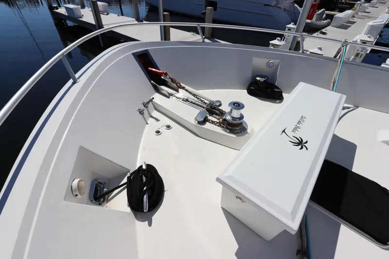 Slide: The Image of 1991 Viking Motor Yacht bow with anchor winch and storage compartments. - 7