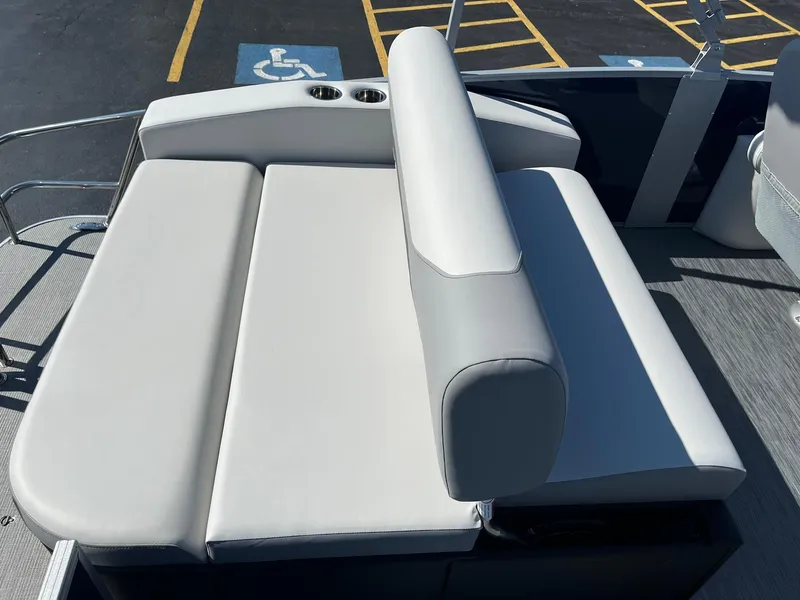 Slide: The Image of 2024 Lowe SS 210 DL boat with white cushioned seating. - 14