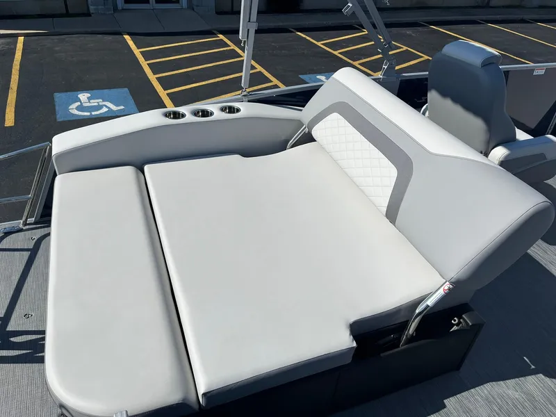 Slide: The Image of 2024 Lowe SS 210 DL boat with spacious, cushioned seating and cup holders. - 15