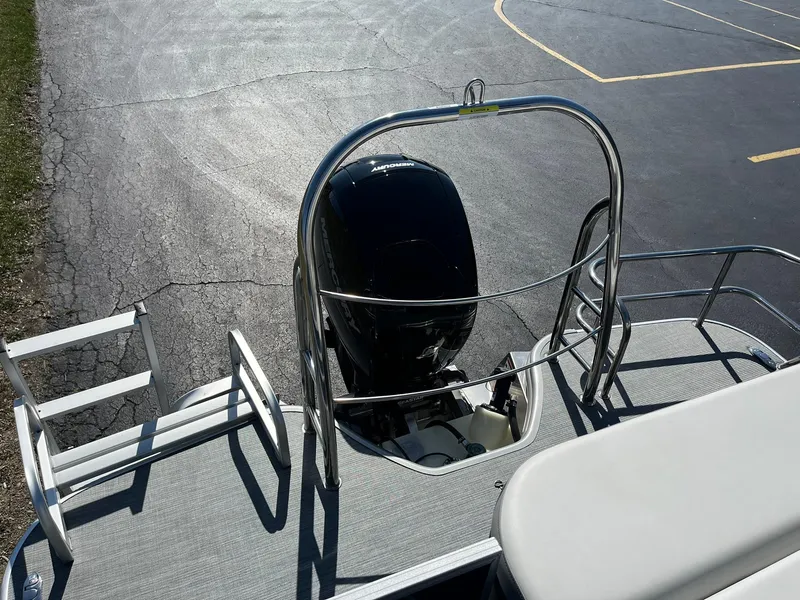 Slide: The Image of 2024 Lowe SS 210 DL pontoon boat with outboard motor and swim ladder. - 19