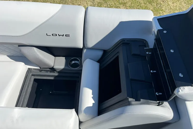 Slide: The Image of 2024 Lowe SS 210 DL boat interior with storage compartment. - 23