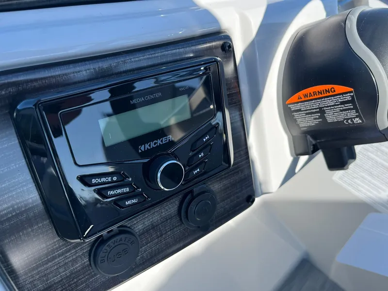 Slide: The Image of 2024 Lowe SS 210 DL boat media center and control panel. - 25