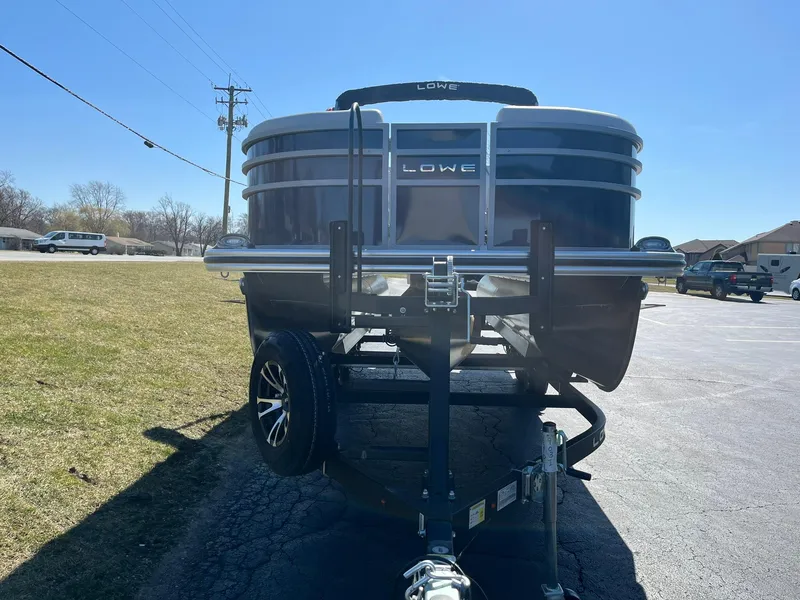 Slide: The Image of 2024 Lowe SS 210 DL pontoon boat on a trailer, front view. - 3