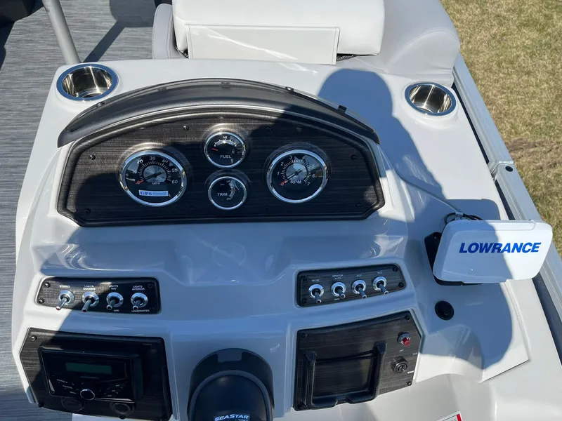 Slide: The Image of 2024 Lowe SS 210 DL boat dashboard with gauges and Lowrance system. - 9